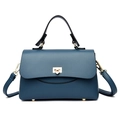 Dark blue leather handbag with litchi texture and golden metal lock on white background - Blue