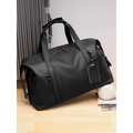 Large black waterproof travel duffel bag with leather luggage tag on a silver suitcase - Grey Large