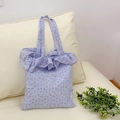 Borsa tote floreale color lavanda con balze e etichetta Magiopocket su divano - Viola