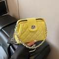 Quilted bright yellow crossbody bag with silver chain strap and metal turn-lock closure - Yellow