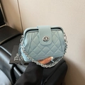 Light blue quilted crossbody bag with silver chain strap and twist-lock closure - Blue
