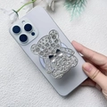 Dettaglio del supporto per telefono a forma di orso con strass su uno smartphone - Argento