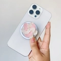Detail of 3D gradient flower phone grip with central pearl accent on white smartphone - Magnetic Stand / Pink Flower