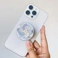 Detail of a 3D blue gradient flower phone grip with pearl accent on a smartphone - Magnetic Stand / Blue Flower