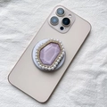 Macro shot of Magsafe phone socket with purple crystal, rhinestones and white pearls - Purple with Pearl Border