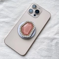 Detailed macro of pink crystal MagSafe phone grip with pearls and rhinestones on back - Pink with Pearl Border