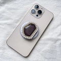 Detail of luxury Magsafe phone grip with purple crystal, rhinestones and white pearls - Gray Pearl Border