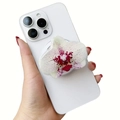 Detailed view of pink orchid acrylic magnetic phone grip on a white smartphone - Magnetic Stand / Red Spotted White Orchid (5)