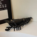 Unique black lobster-shaped saddle bag with golden metal studs and adjustable strap - Black
