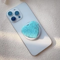 Dettaglio del supporto per telefono a cuore azzurro con glitter su smartphone bianco - Paillettes Cuore Blu