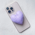 Detail of a soft padded heart-shaped fabric phone grip in lavender on a smartphone back - Magnetic Stand / Purple Fabric Heart
