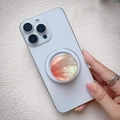 Detail of gradient macaron shell texture on a magnetic circular phone grip with aurora shine - Magnetic Stand / Orange Gradient Shell