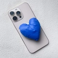 Blue heart-shaped puffy fabric magnetic phone stand on a grey smartphone back - Magnetic Stand / Blue Fabric Heart
