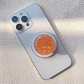 Macro shot of bright orange glitter phone grip attached to a white iPhone back - Magnetic Stand / Orange Fine Powder Small Sequins