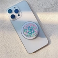 Dettaglio del supporto magnetico glitter con paillettes a cuore su uno smartphone - Supporto Magnetico / Cuore Blu Paillettes Piccole