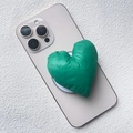 Close-up of a green padded fabric heart phone socket with glossy quilted texture - Magnetic Stand / Green Fabric Heart