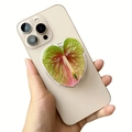Acrylic heart leaf magnetic phone grip stand on a yellow iPhone with three cameras - Colorful Heart Anthurium (20)