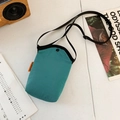 Japanese style teal canvas crossbody phone bag with adjustable black strap and side label - Blue