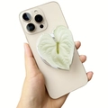 Macro shot of an acrylic heart-shaped Griptok with leaf pattern on a white smartphone - White Calla Heart Petal (19)