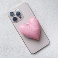 Close-up of pink heart-shaped puffy fabric phone stand with a soft satin finish texture - Magnetic Stand / Light Pink Fabric Heart