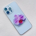 Detail view of a purple orchid phone grip attached to the back of a blue smartphone - Deep Purple Veined Orchid Style (20)