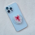 Close-up of a green leaf shaped magnetic phone grip attached to a light blue smartphone - Red Vein Green Edge Realistic Caladium Style (20)