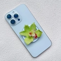 Detail of green orchid acrylic phone grip with magnetic attachment on a blue smartphone - Light Green Realistic Orchid Style (3)