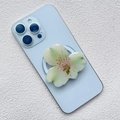 Detail view of the 3D orchid acrylic magnetic phone stand on a blue smartphone - Green White Gradient Orchid Style (1)