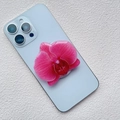Detail of pink orchid acrylic phone socket with resin texture on a blue smartphone - Deep Pink Orchid Style (K5)