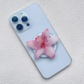 Close-up of a pink gradient orchid phone grip on a light blue smartphone case - Pink Gradient Orchid Style (K4)
