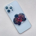 Detail view of orchid flower phone socket with purple leopard print petals on phone - Deep Purple Leopard Orchid Style (11)