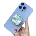 Colorful natural shell magnetic phone stand with gold trim on a blue smartphone - Square Green Scallop