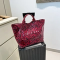Red leopard print tote bag with white text on a grey suitcase for beach travel - Leopard Style