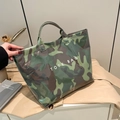 Large capacity tote bag with green camouflage print and white lettering detail - Camouflage