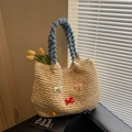 Handcrafted straw tote bag featuring colorful bows and plush blue velvet handle - Off White