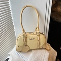 Light yellow retro faux leather Boston bag with metal eyelets and long round handles - Yellow