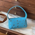 Bright blue underarm bag with silver metallic eyelets and litchi texture finish - Blue