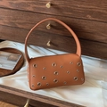 Brown leather shoulder bag with silver eyelets and a stylish rectangular silhouette - Brown