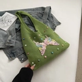 Green knitted tote bag with pink butterfly floral appliques and colorful pearl bead accents - Green
