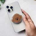 Close-up of a cute brown poodle acrylic Griptok phone stand mounted on a white smartphone - Teddy Dog