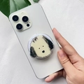 Detail of cute dog acrylic expanding phone grip held on a white smartphone - Old English Sheepdog