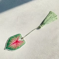Detail of leaf-shaped acrylic bookmark with pink veins and a green silk tassel - Pink Vein Style (5)