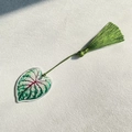 Detailed macro view of acrylic leaf bookmark with vibrant red veins and green silk tassel - Coleus Mixed Color Style (9)