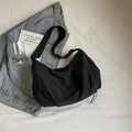 Black nylon crossbody bag with drawstring details and wide strap for casual travel - Black