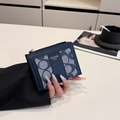 Navy blue leather card holder with geometric ring pattern and golden zipper closure - Blue
