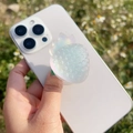 Detailed view of iridescent resin strawberry phone grip attached to a white smartphone - Matte Colorful Yellow Strawberry