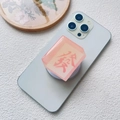 Detailed view of pink translucent resin mahjong phone socket with red character engraving - Magnetic Stand / Pink Fortune Character