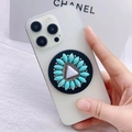 Detail of turquoise floral phone socket with silver metallic beads on a white smartphone - Radial Turquoise Petal Style (12)