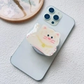 Close-up of a cat-shaped acrylic magnetic phone grip featuring a red lucky bell design - Magnetic Stand / Tiger