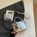 Silver metallic bucket bag with cartoon charm and pearl strap for stylish women - Silver With Pendant